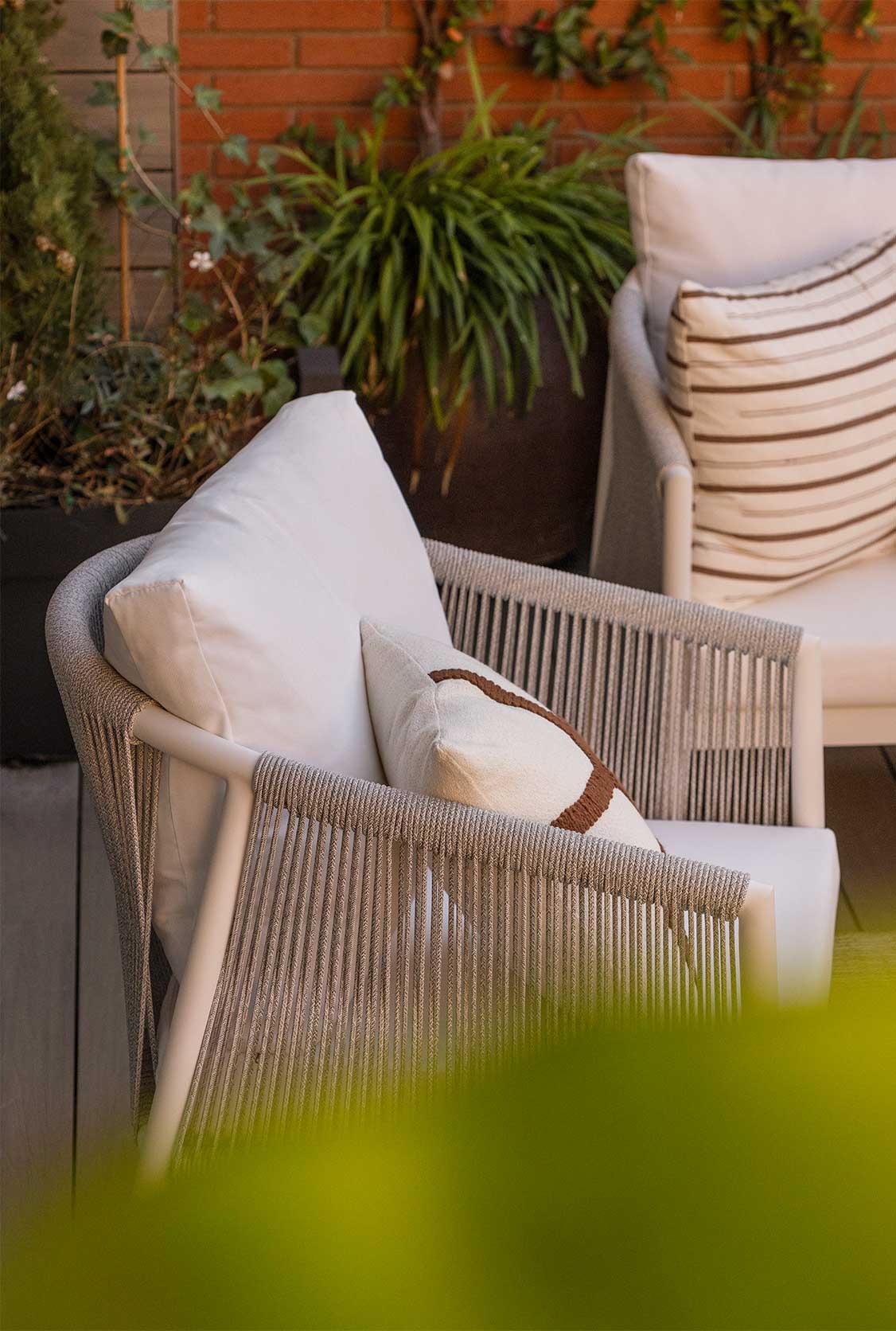 Outdoor chair with decorative cushions